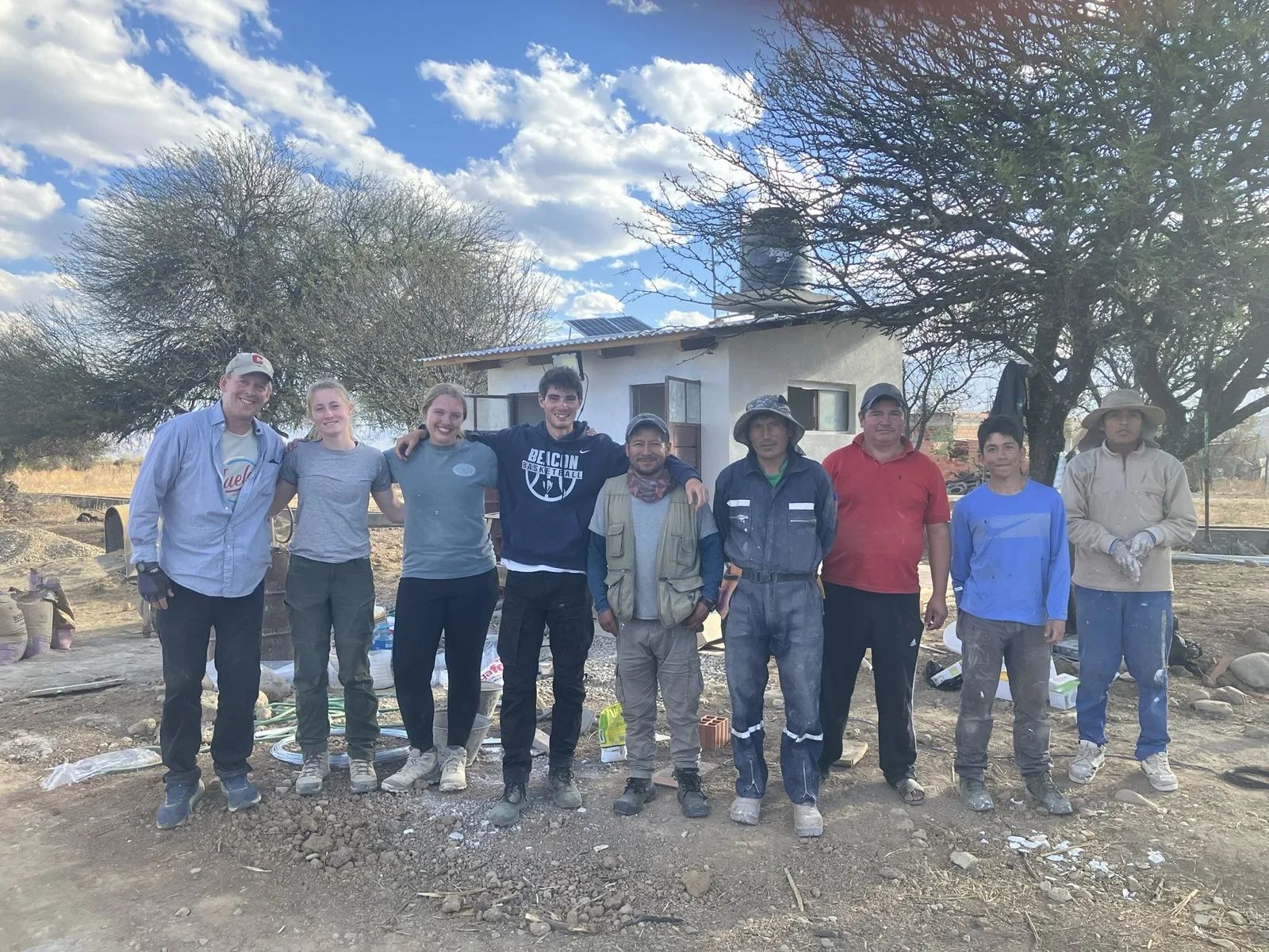 Group photo of the team and community partners after the build