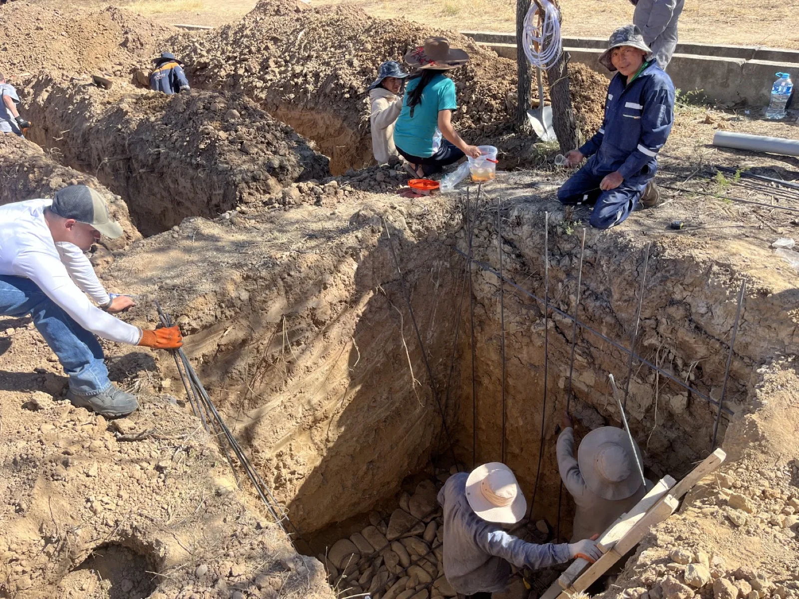 Crew excavating the deep pit for the septic tank