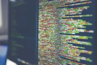 Code on a monitor, representing the Cornell Wardrobe app build